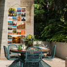 Instawall Tuinposter Tall 1:2 fotocollage als buitenwanddecoratie bij een tuinset.